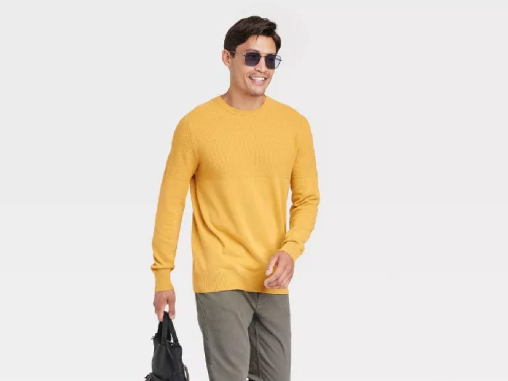 man wearing yellow sweater