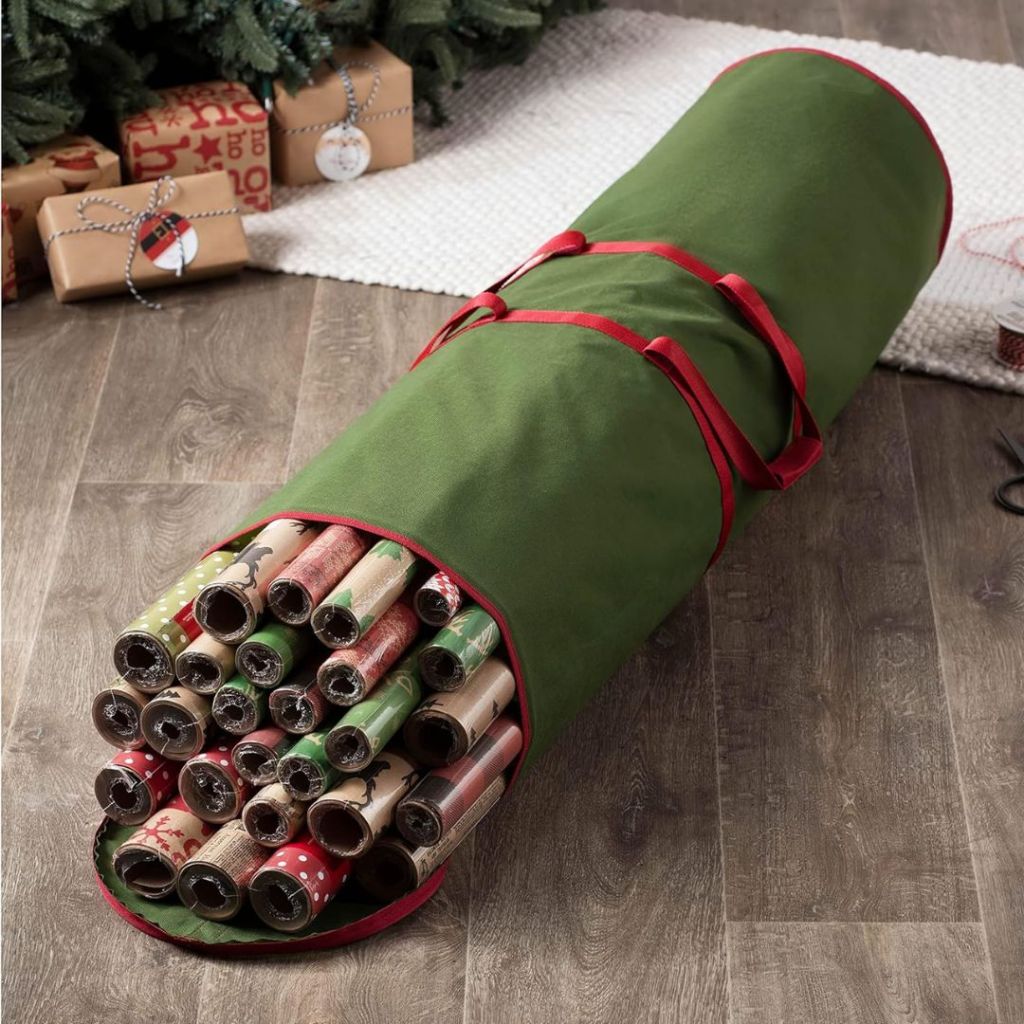 green wrapping paper storage bag on floor with wrapping paper rolls inside