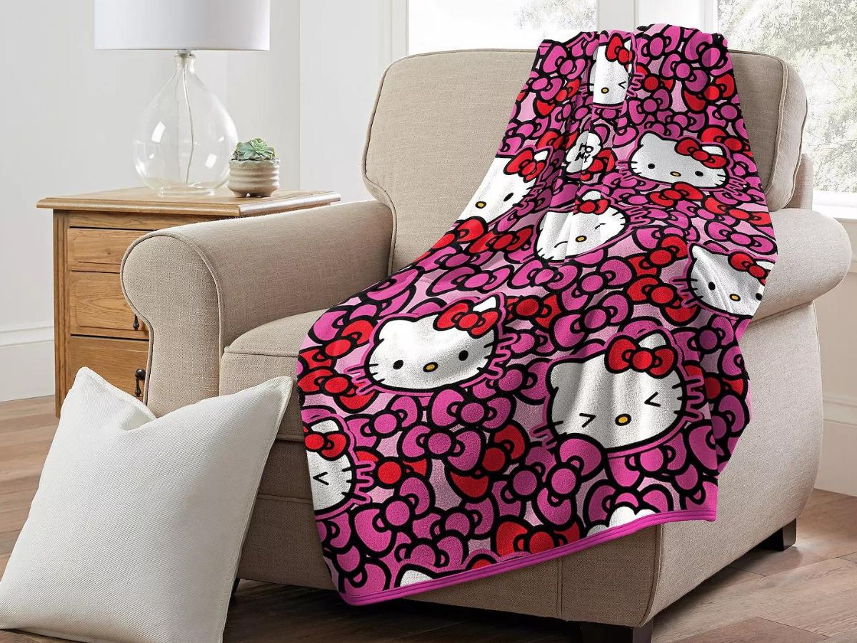 Hello Kitty More Bows Please Silk Touch Throw Blanket on a chair 