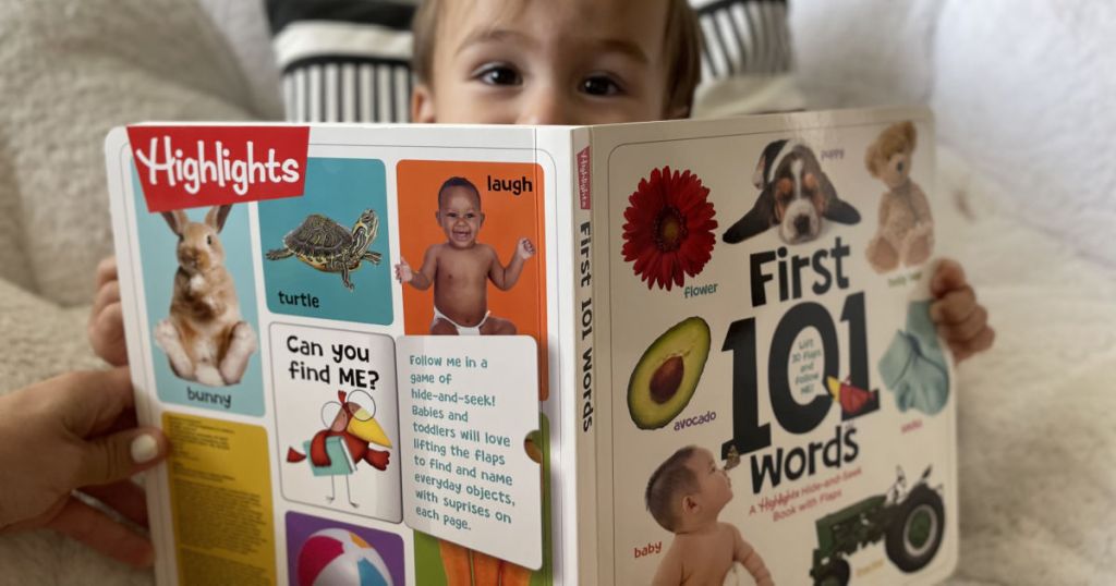 boy holding a Highlights First 101 Words
