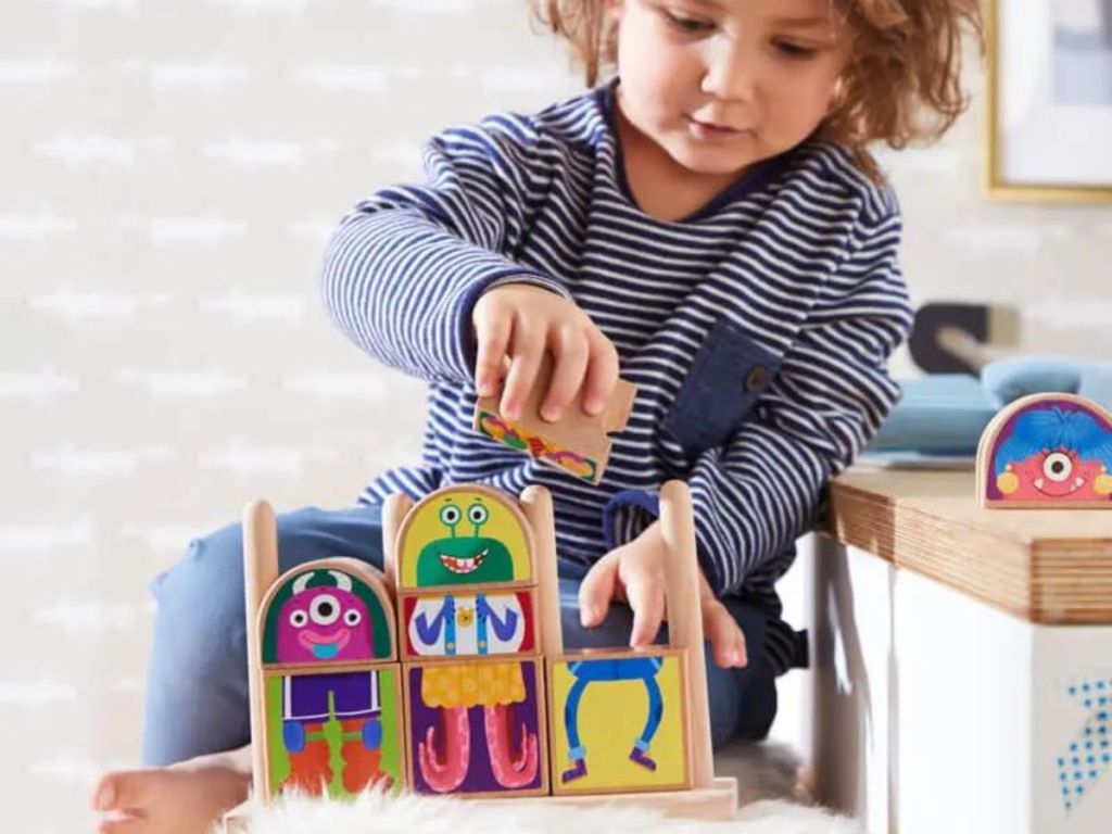 kid playing with monster blocks
