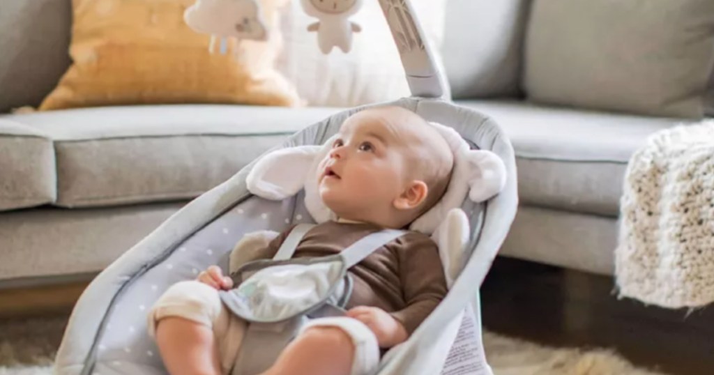 baby in gray bouncer seat