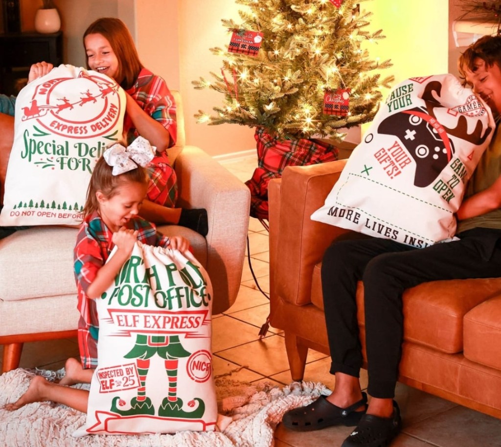 kids holding Santa sacks