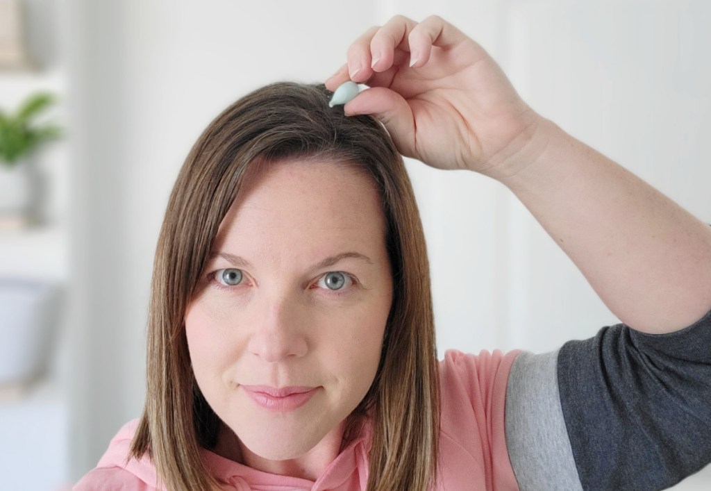 Woman using Keratin Hair Serum Capsules