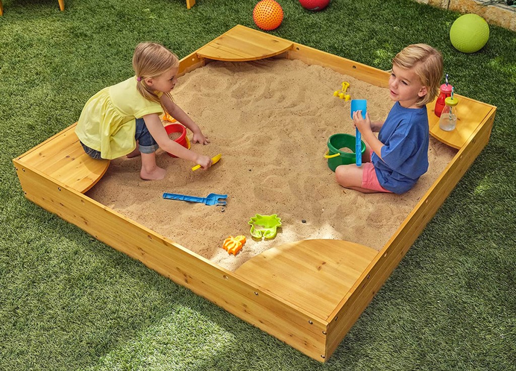 kids playing in KidKraft Wooden Backyard Sandbox