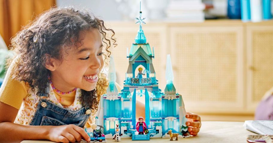 kid looking at LEGO Disney Frozen Elsa&rsquo;s Ice Palace