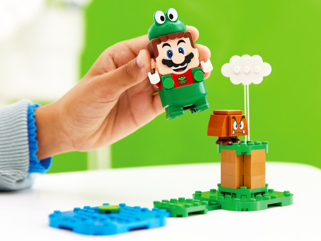 kid playing with Super Mario Frog Power Up set