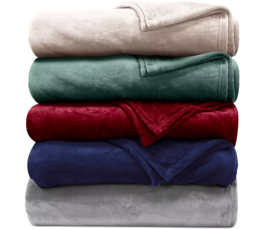 folded stack of plush blankets