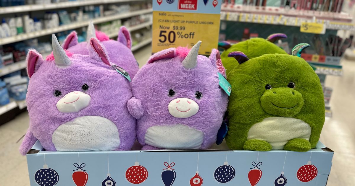 Light up plush animals in a bin in the store.