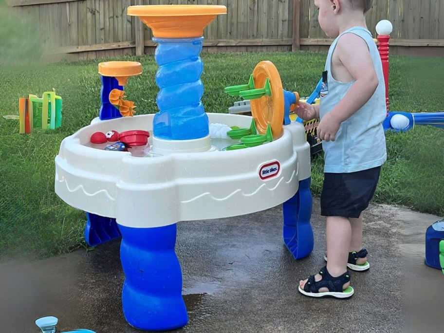 child playing with Little Tikes Spiralin' Seas Waterpark Table