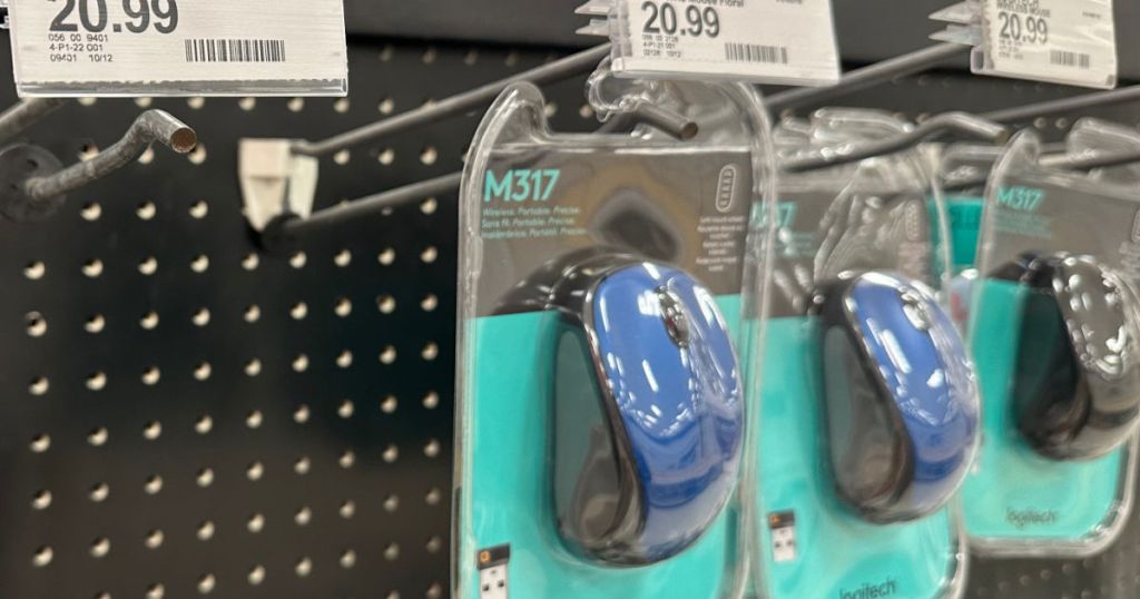 black and blue wireless mouse on shelf