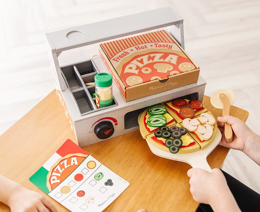 kids playing with pizza oven toy