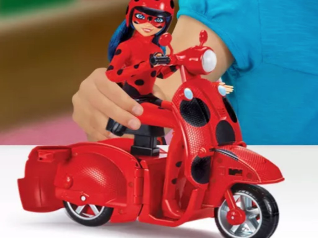 red bike and doll