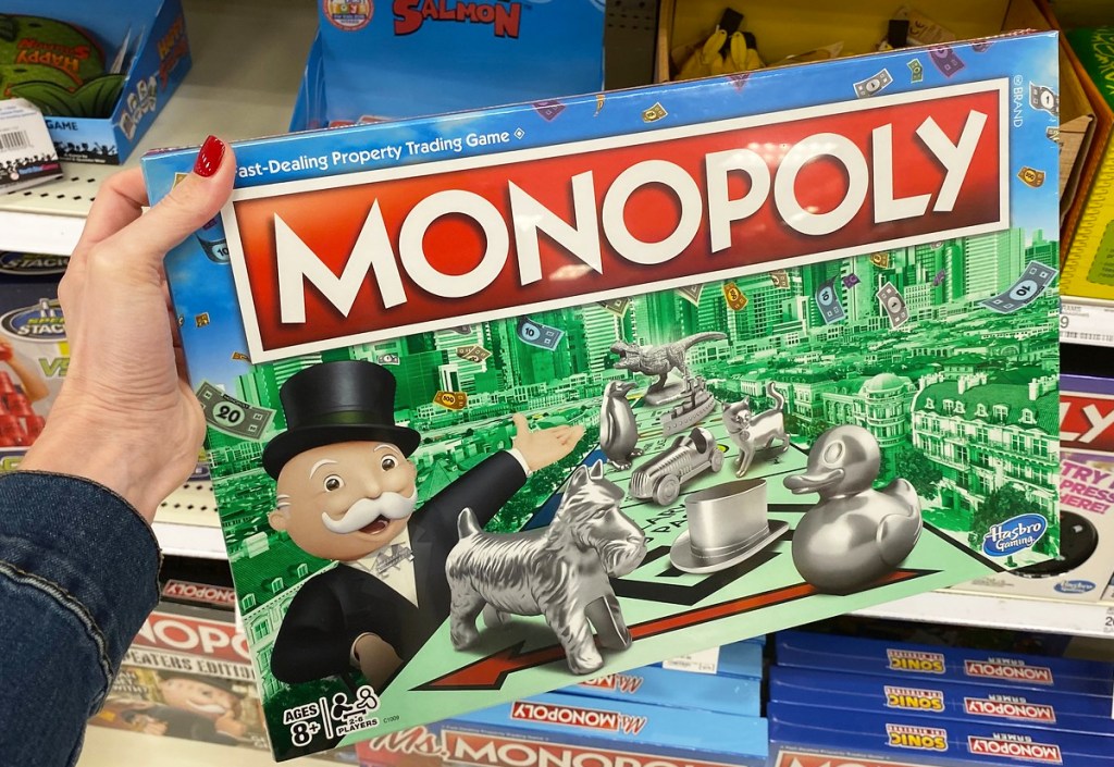 hand holding monopoly board game