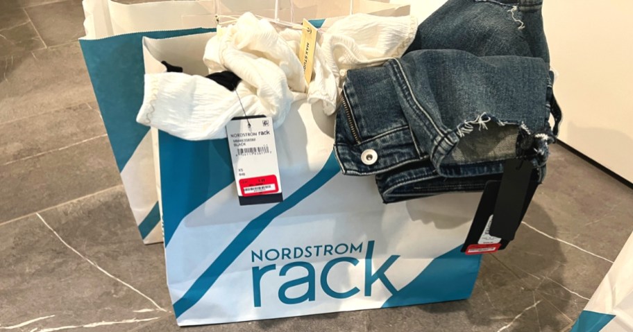 clothing inside of norstrom rack shopping bag