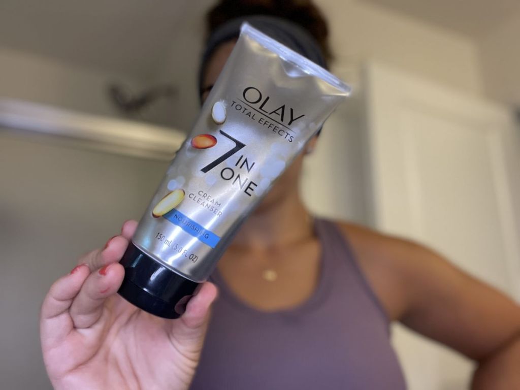 woman holding an Olay Cream Cleanser