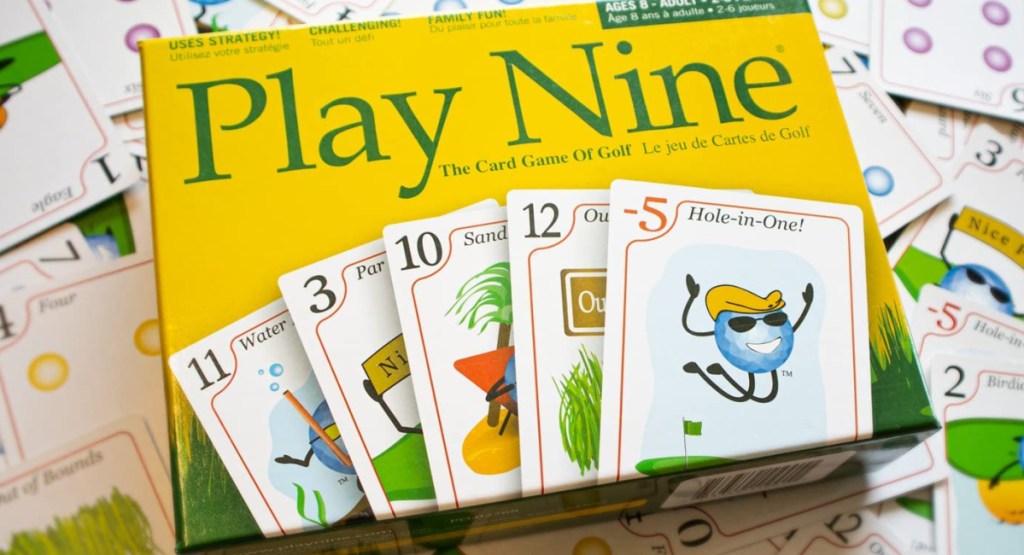 PLAY NINE - The Card Game on a bed of cards