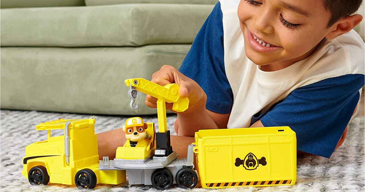 Little boy playing with Paw Patrol Rubble Transforming Truck