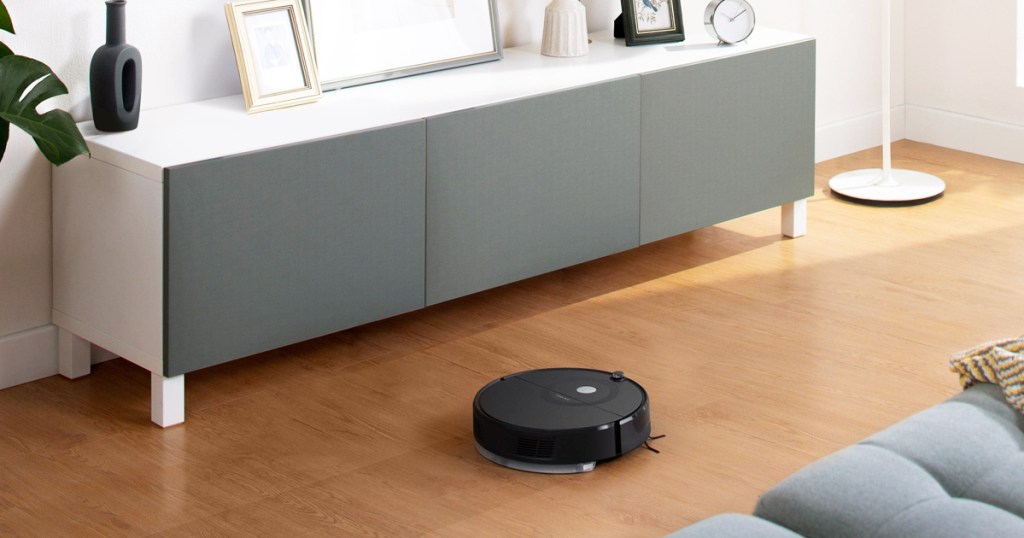 black robot vacuum in living room