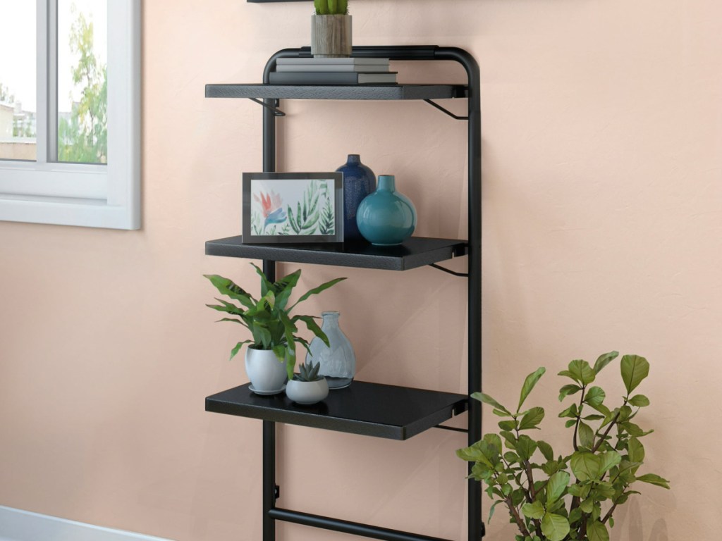 Sauder 3-Tier Leaning Bookshelf mounted on wall