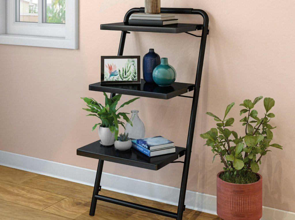 Sauder 3-Tier Leaning Bookshelf with items on it