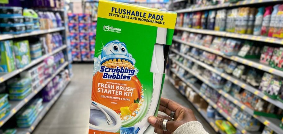 Scrubbing bubbles toilet wand starter kit being held in a store aisle