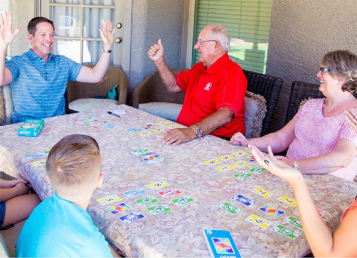 Family playing Skyjo Card Game at table