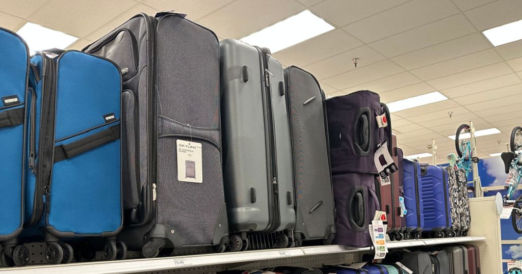 gray and blue softside luggage on shelf