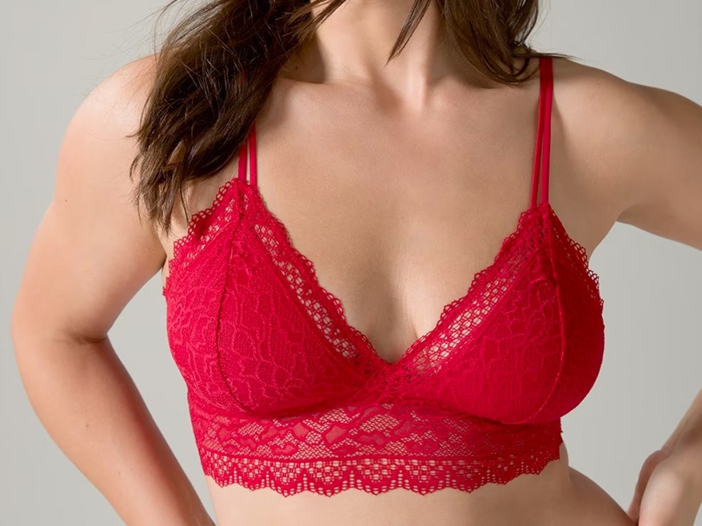 woman in red lace bralette