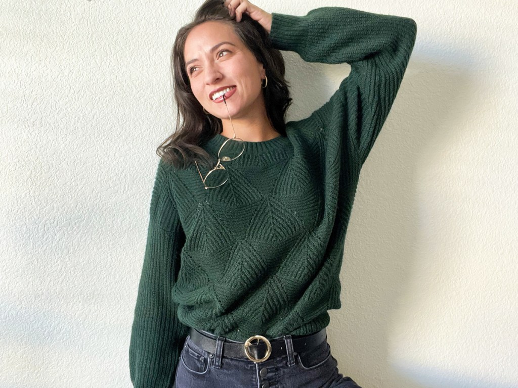 woman wearing dark green sweater