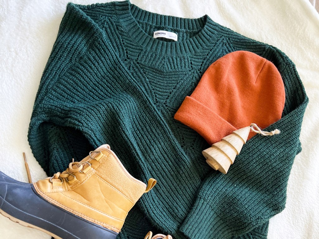 green sweater with hat and boots