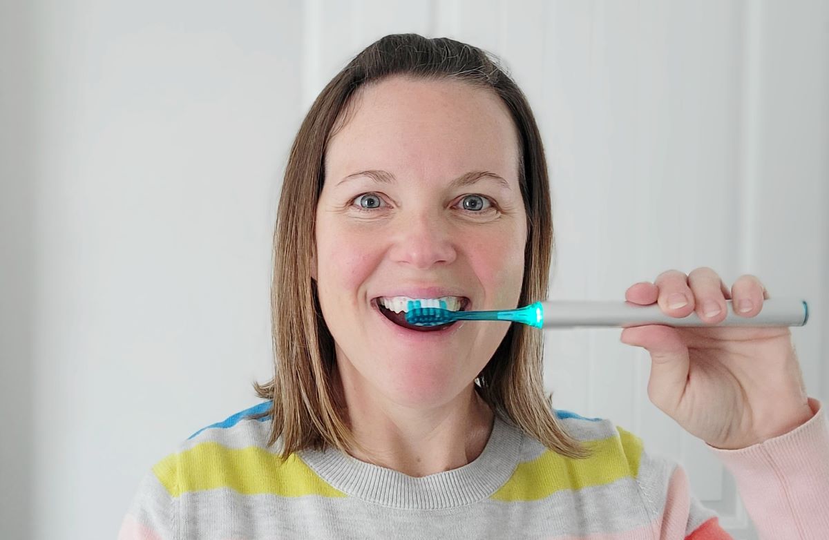 woman using a Soocas Spark Toothbrush