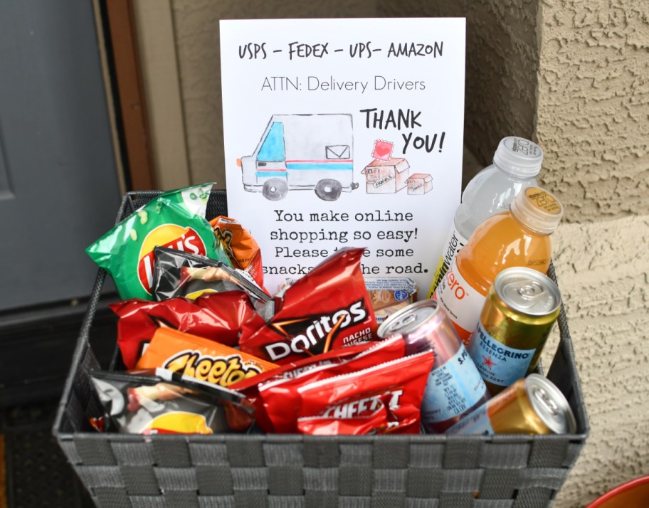 A gift box with a free delivery driver thank you sign