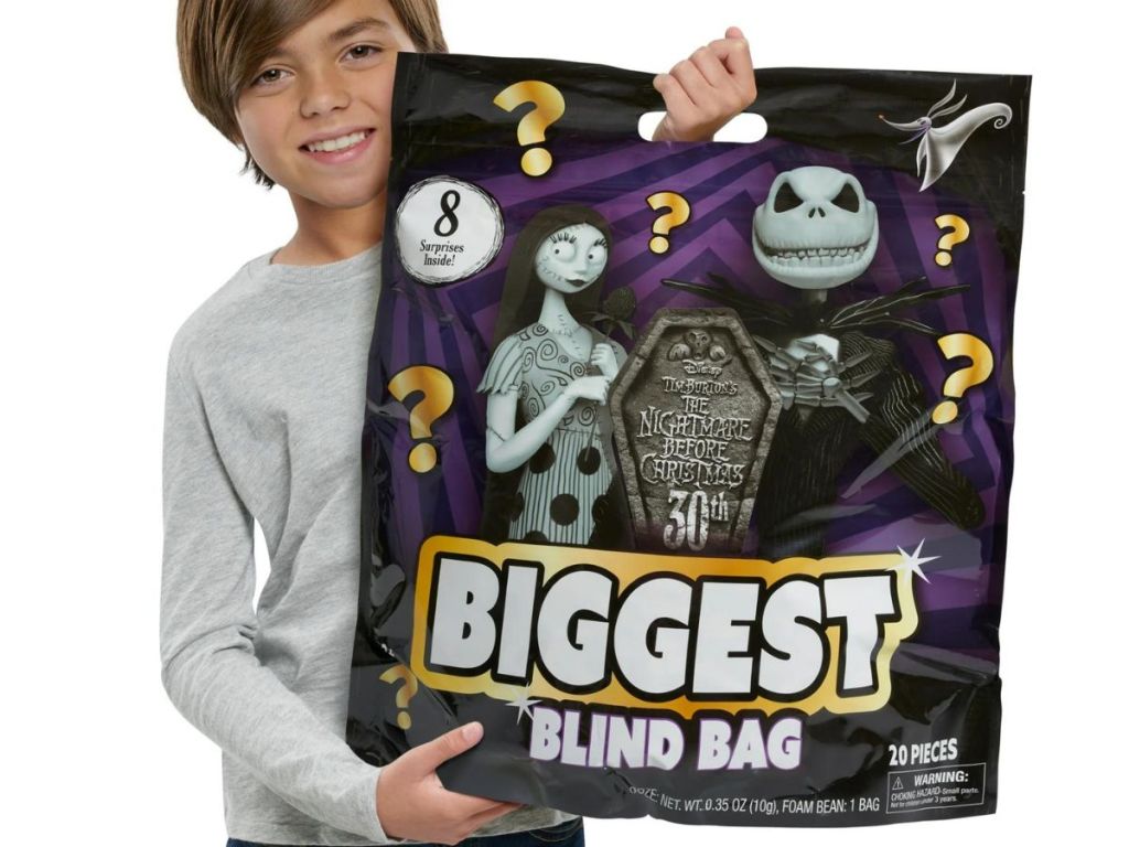 Child holding a Nightmare Before Christmas biggest blind bag