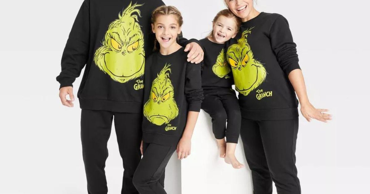 family wearing The Grinch matching fleece