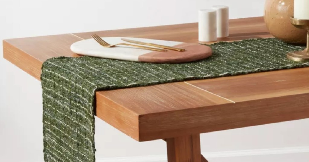 green table runner on wooden table