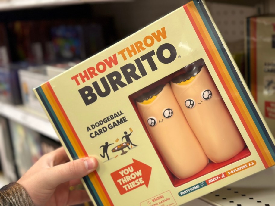 person taking Throw Throw Burrito Game off shelf