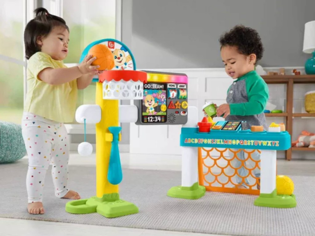 girl and boy Toddlers playing with Fisher Price Laugh & Learn Sports Activity Center