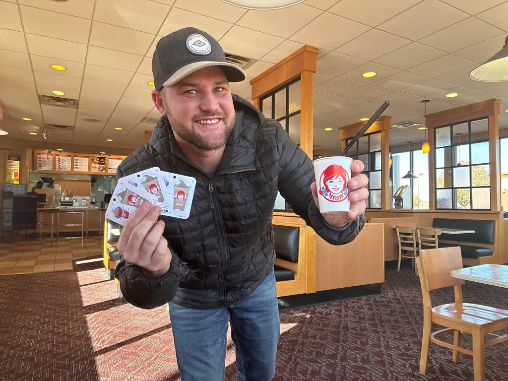 Man holding Wendy's Frosty Tags