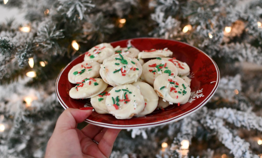 White Chocolate Thin Mints on a plate in front of a christmas tree