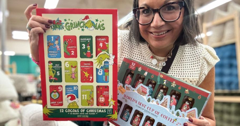 A woman holding two advent calendars