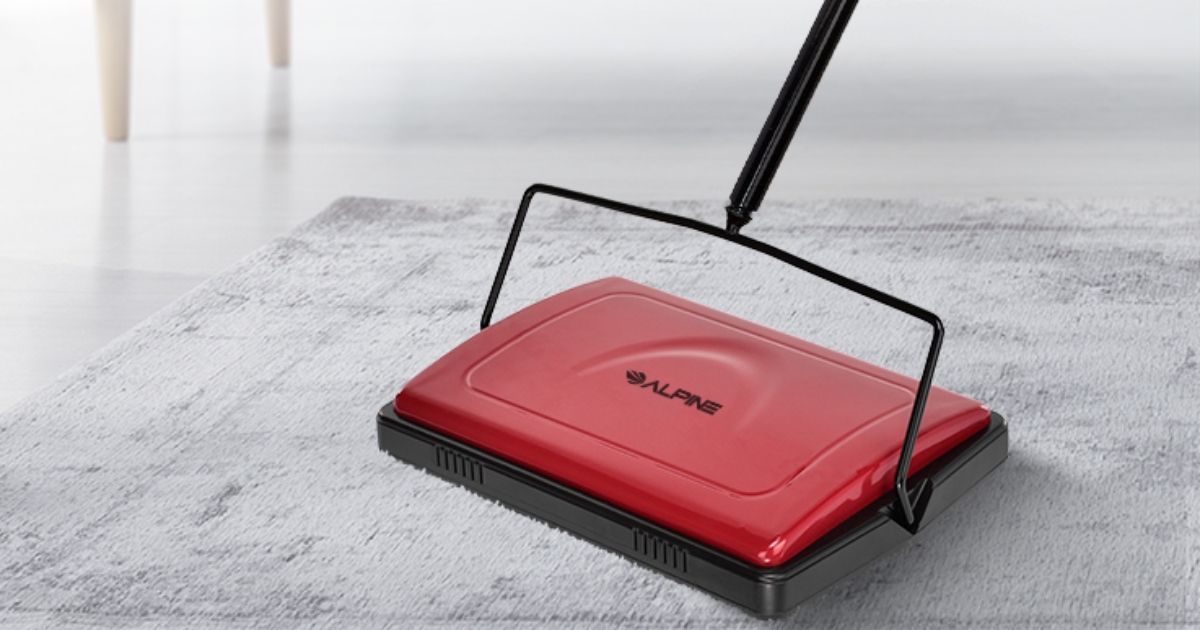 red carpet sweeper on a light colored carpet