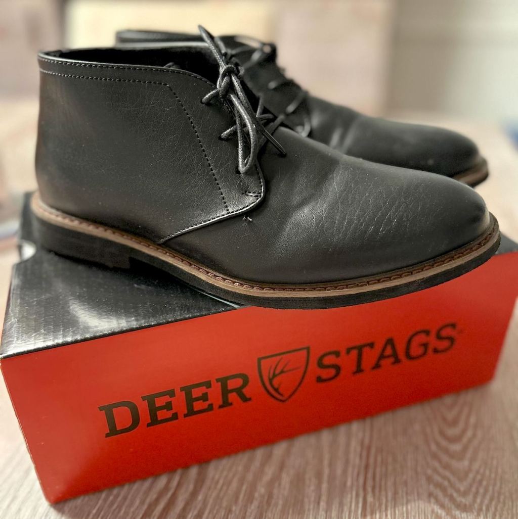 black dress shoes on deer stags shoe box