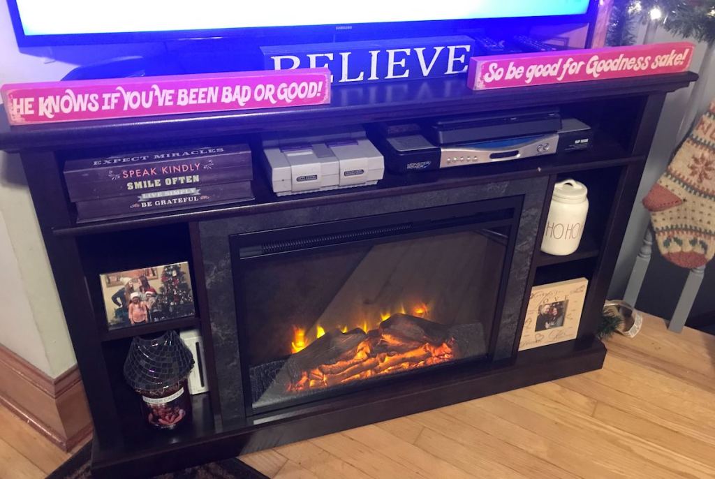corner electric fireplace with tv on top