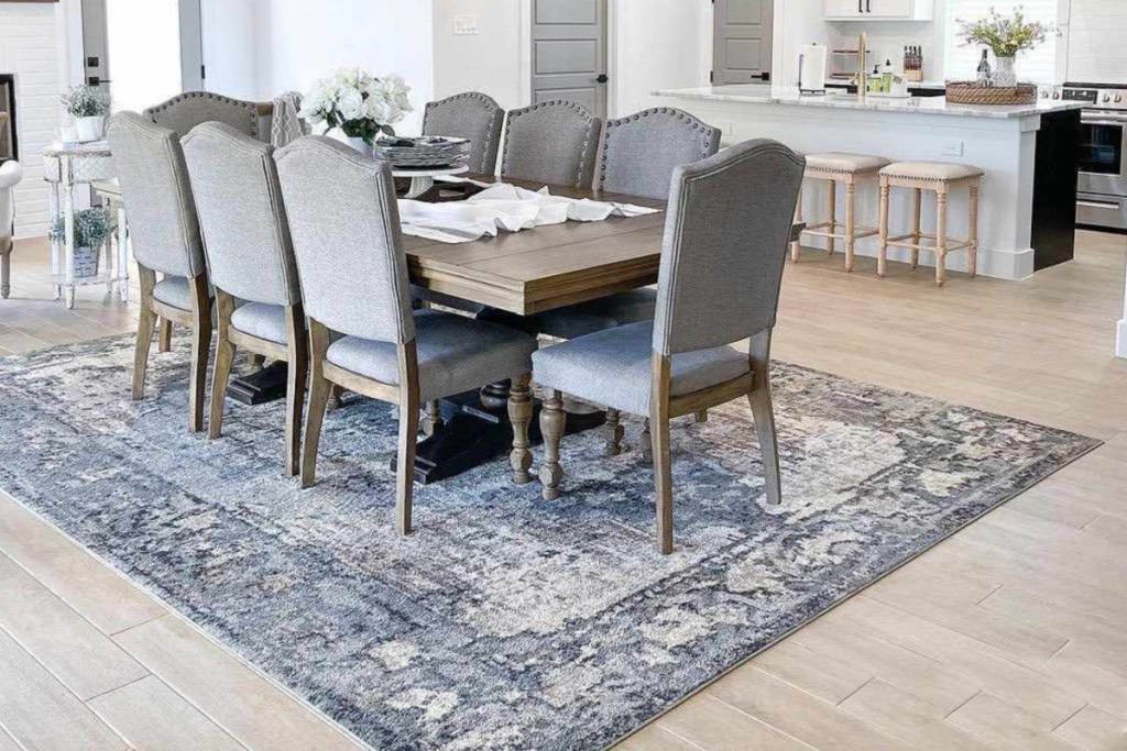 blue and grey rug under dining table