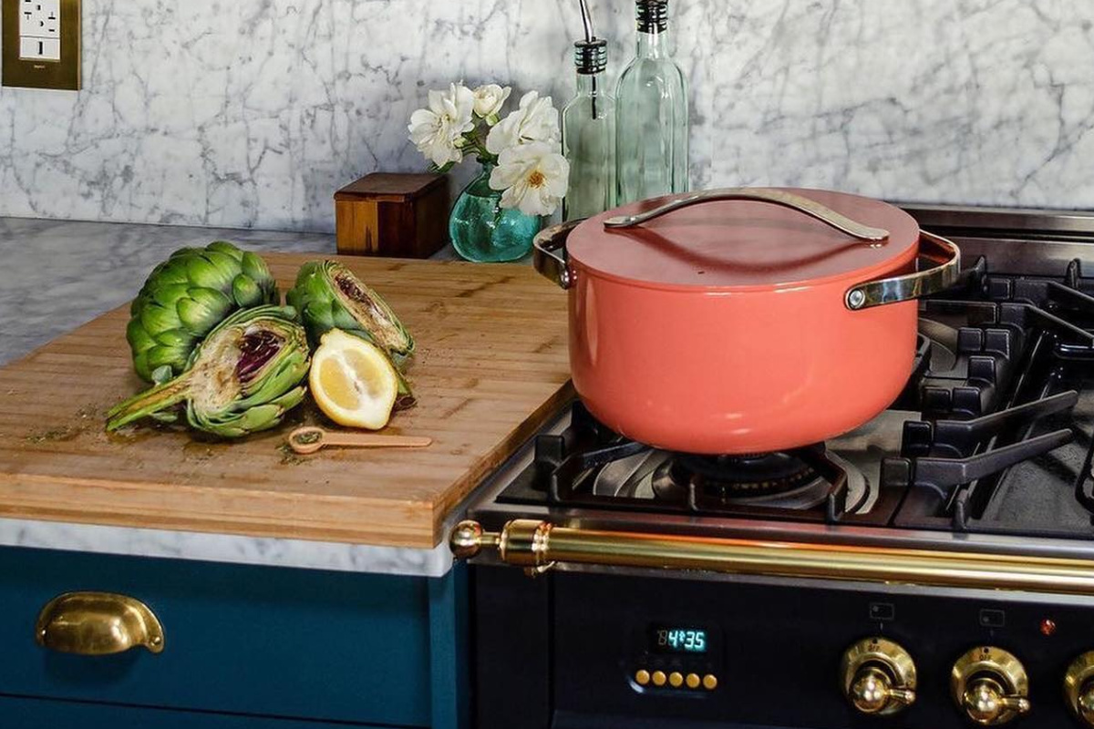 pink dutch oven on stove