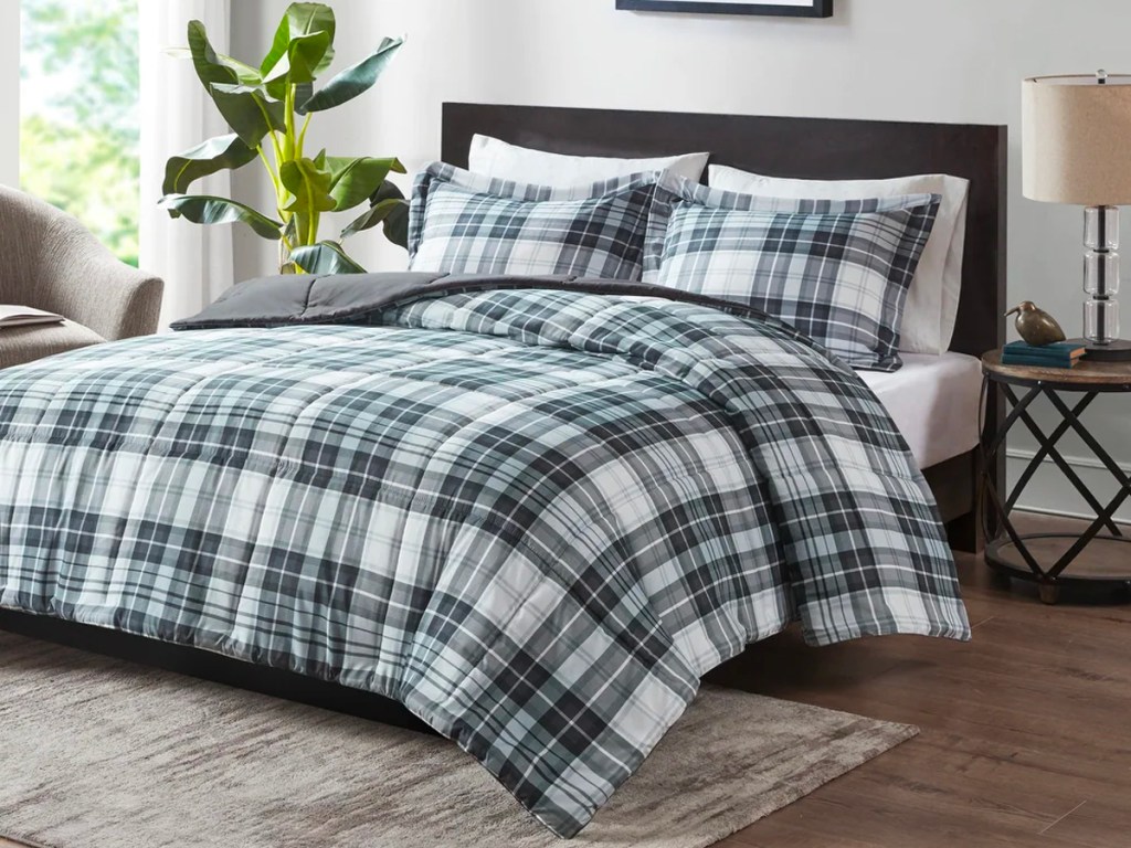 plaid comforter set on bed with pillows