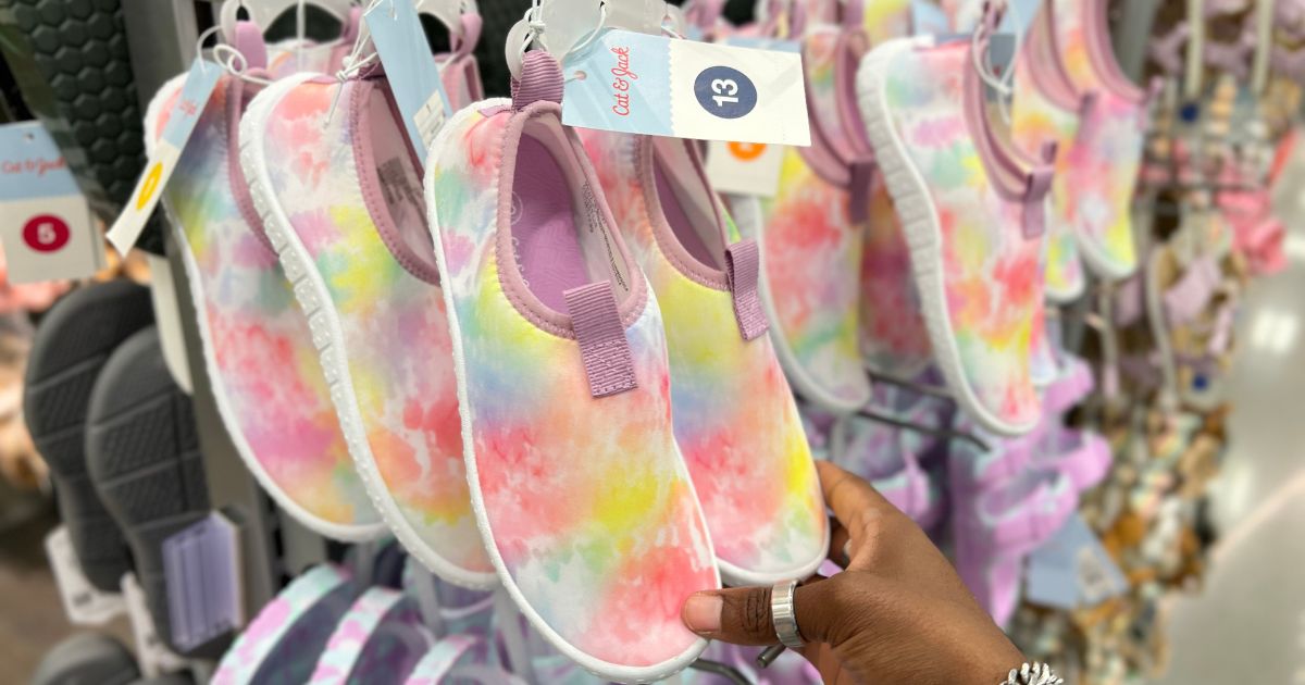 colorful tie-dye water shoes hanging in store