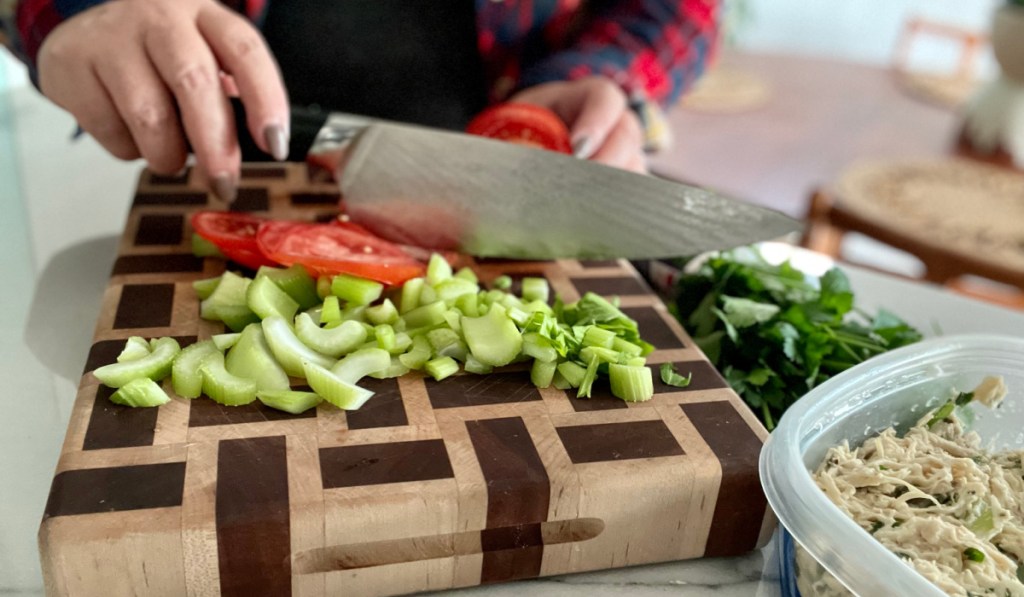 chef knife cutting veggies