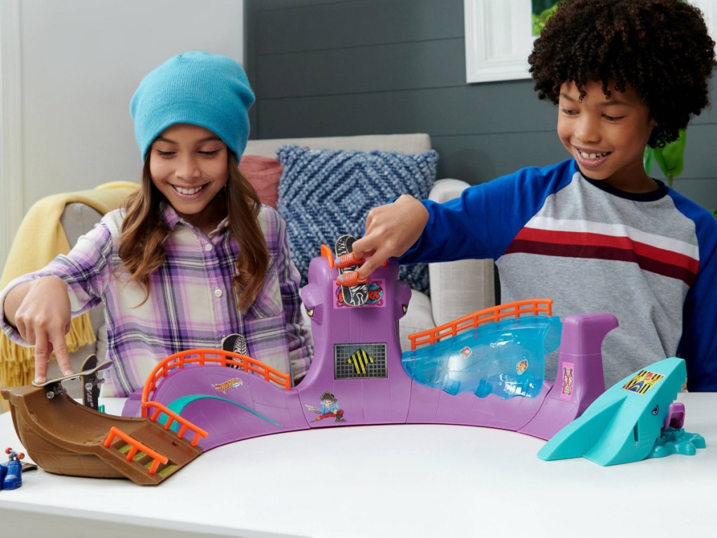 child playing with Hot Wheels Skate Octopark Playset